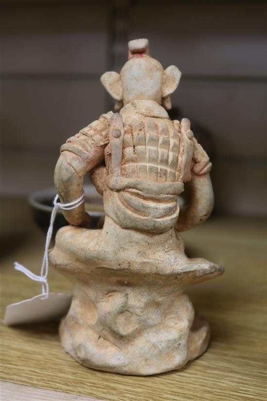A Chinese green glazed jar, two other pottery jars and a pottery figure